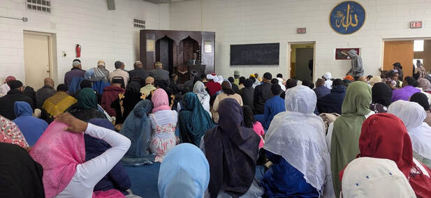 Community gathering at Masjid Wali Muhammad
